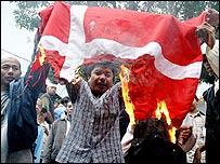 Protesters set fire on a Danish flag during a demonstration in Surabaya, 06 February 2006. 